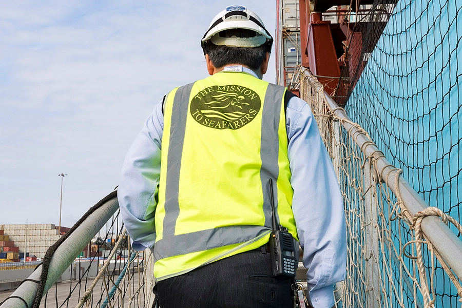 A volunteer for Mission to Seafarers Canada, boards a commercial ship to support seafarers and crews.