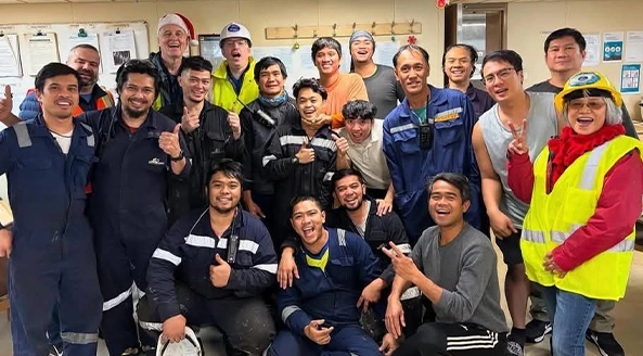 Vancouver seafarers posing happily after a ship visit